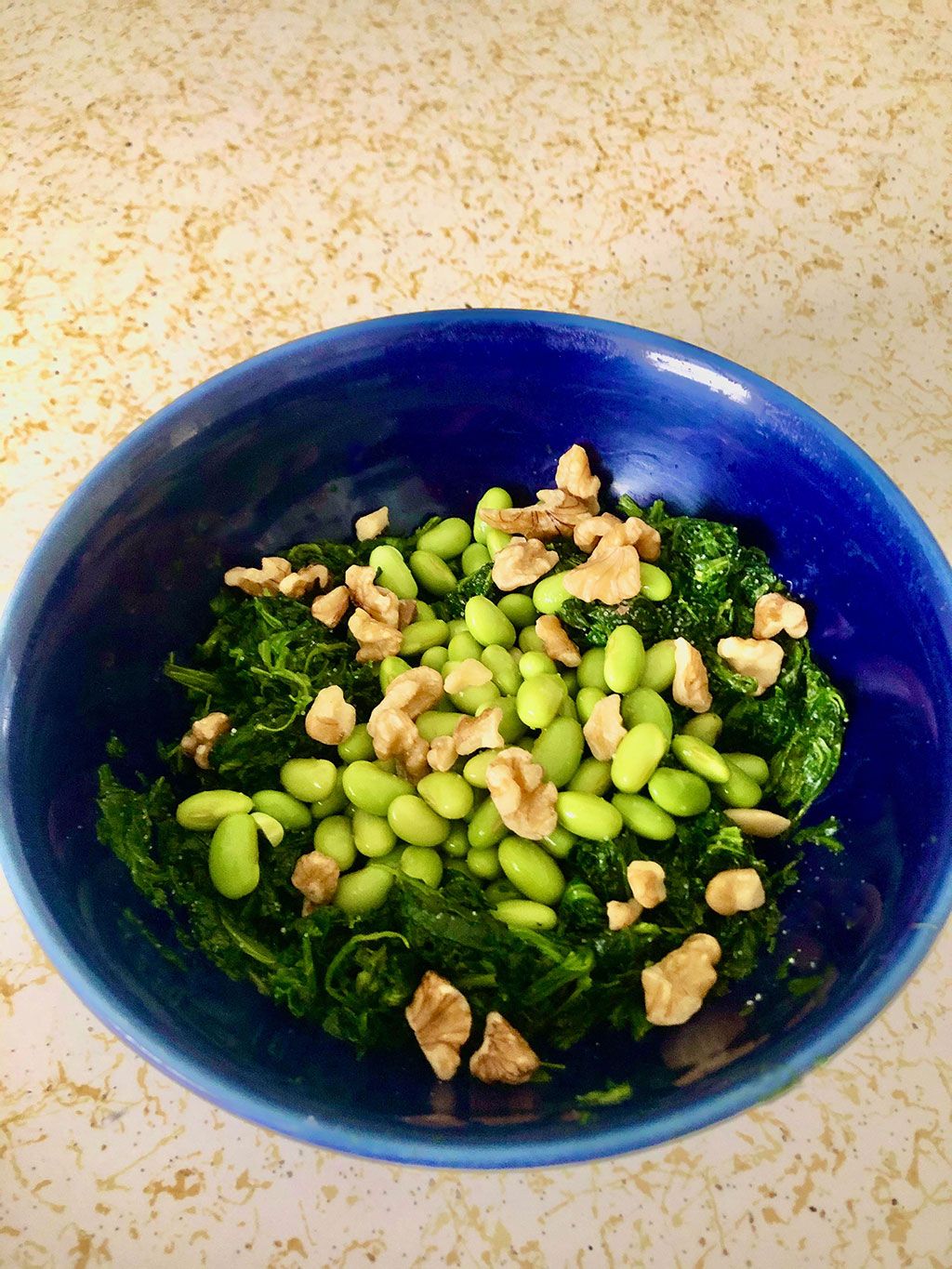 Soybean and spinach breakfast with walnuts
