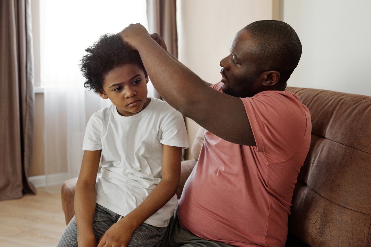 Son is taught acts-of-service love language by father who combs his hair